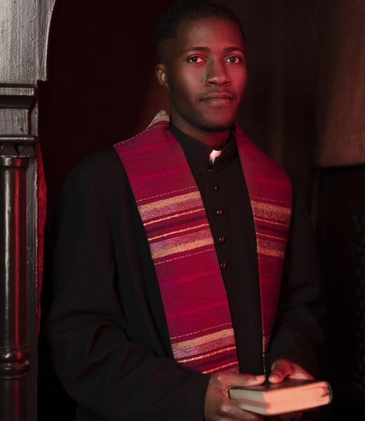 young-male-priest-with-bible-church